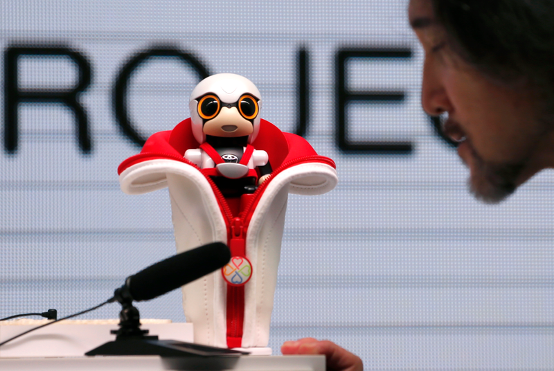 Illustration for article titled Toyota's Cupholder Robot Could Keep You Safe on the Road